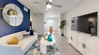 Located in Sandy Springs, GA, this well-appointed 2-bedroom, 2-bathroom residence offers a thoughtfully designed single-level layout that balances comfort and functionality. The open living area welcomes you with light wood-look flooring, a ceiling fan, and a bold blue accent wall that adds a distinct visual anchor to the space. Natural light filters in through plantation-shuttered windows, and the room flows seamlessly into a defined dining area, creating an inviting, open feel.

The kitchen features granite countertops, white cabinetry, and stainless steel appliances, including a dishwasher and refrigerator, offering both style and practicality.

The spacious primary bedroom includes plush carpet, a ceiling fan, sliding glass door access, and an ensuite bathroom with a wide granite-topped vanity, white cabinetry, and wood-look flooring. The second bedroom is equally comfortable, highlighted by a vibrant orange accent wall, carpet flooring, a ceiling fan, and a sliding glass door. The second bathroom mirrors the refined finishes of the first, featuring a granite vanity and a tub-shower combination with a decorative curtain.

Three closets and three hallways throughout the unit provide ample storage and ease of circulation, completing this well-organized and stylishly finished residence.