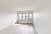 Located at 1150 Boul de la Côte-Vertu in the Saint-Laurent borough of Montréal, this well-appointed one-bedroom, one-bathroom unit offers a clean, modern aesthetic defined by bright white walls and light-toned hardwood flooring throughout the main living areas. Large windows flood the living room with natural light, while a glass door provides access to an outdoor balcony with open views of the surrounding neighbourhood. The layout flows naturally from the entryway — which features multiple closets for ample storage — through to the open living spaces. The kitchen is thoughtfully updated, showcasing white shaker-style cabinetry, marble-look tile flooring, a subway tile backsplash with a veined marble finish, stone-look countertops, and stainless steel appliances including a dishwasher and range. The bedroom is a comfortable, well-lit retreat with its own closet and large windows that invite generous daylight. The bathroom is finished in a neutral palette with a white vanity, gold-toned hardware, and terrazzo-style tile flooring, lending a clean and timeless feel. Baseboard heating is present throughout, and the overall ambiance of the unit is bright, airy, and move-in ready.