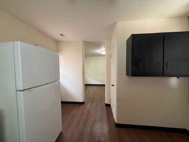 Building Photo - Tranquility inside. City adventures outside. Discover both in Downtown Cary!