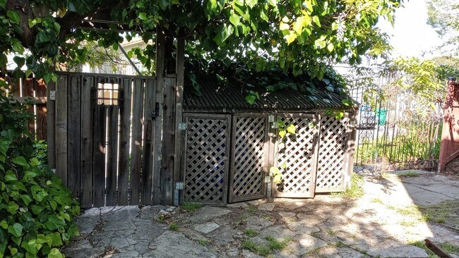 gated front yard with trash enclosure - 625 Morgan Ave
