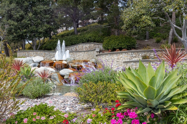Splendid gardens greet you as you drive to your new Lake Forest home.