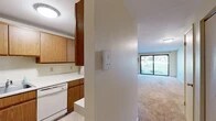Located at 148 Chicopee Mews in Camillus, NY, this single-floor, 2-bedroom, 2-bathroom residence offers a practical and comfortable layout. The kitchen is well-equipped with ample warm oak cabinetry, white laminate countertops, a stainless steel sink, an electric range, and a dishwasher — all set atop tile flooring. It opens toward the living area, creating a connected flow throughout the main living space. The spacious living room is carpeted, flooded with natural light, and features a large sliding glass door that opens to a view of lush green outdoor surroundings, along with a wall-mounted air conditioning unit and baseboard heating. Both bedrooms are carpeted and bright, with the primary bedroom offering generous square footage, a closet, and a window with outdoor views. The second bedroom also includes closet space. In total, four closets are distributed throughout the unit, providing ample storage. Both bathrooms are cleanly finished with tub-shower combinations; one features a wood-toned vanity with a medicine cabinet mirror. Baseboard heating is present throughout the home. Two hallways connect the rooms seamlessly. The overall ambiance is clean, neutral, and move-in ready.
