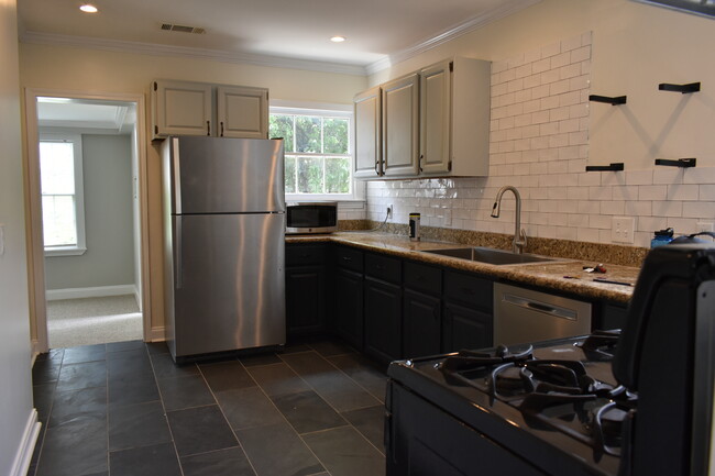 (upstairs kitchen shown) styling similar to downstairs unit kitchen - 2303 Goldsmith St