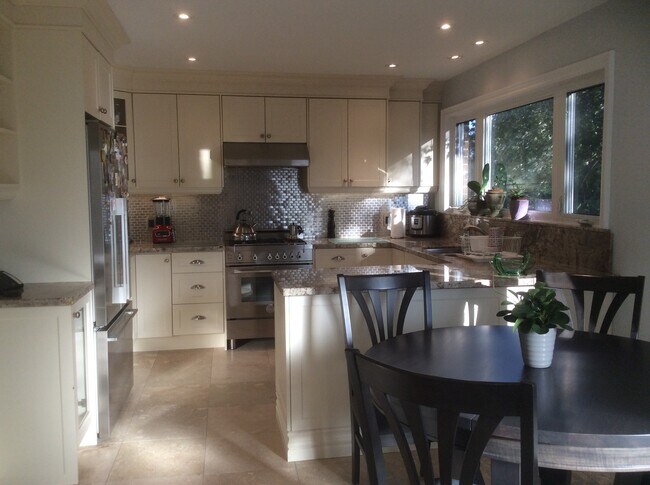 Main Floor Kitchen with lovely backyard views - 29 Lois Av