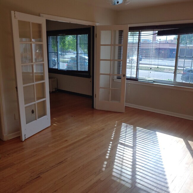 Living room into bedroom 1/office - 1528 N Emerson St