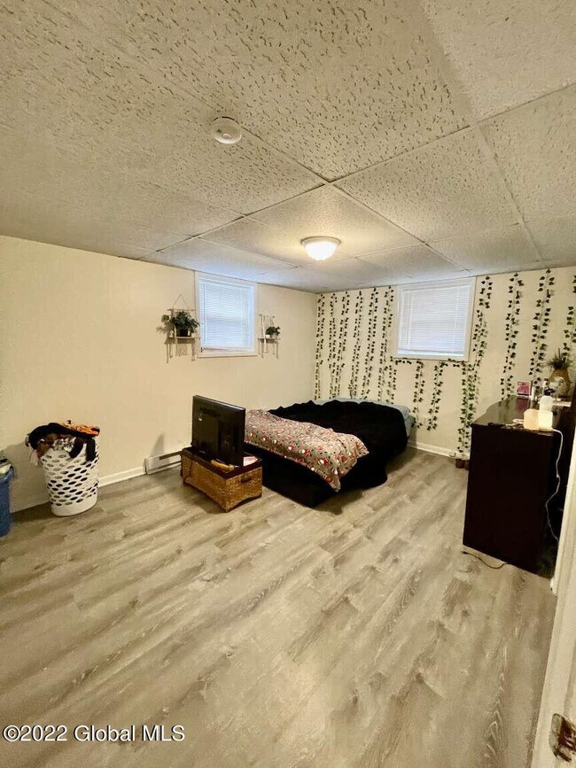 Master bedroom shown with furnatures - 52 Beacon Ave