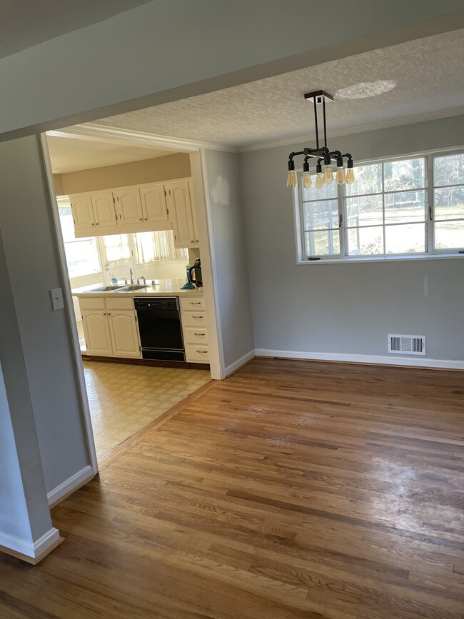 Open kitchen, living and dining area with lots of natural light - 3322 Wraywood Pl
