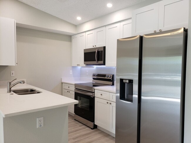 Photo - Ground Level Condo; Private Driveway; Corn...