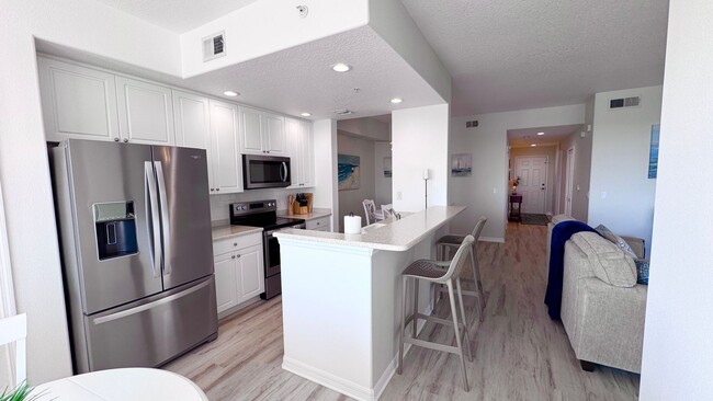 Building Photo - Elevated Luxury at The Terraces – 4th Floor Lake & Golf Course Views! 55+ Community!