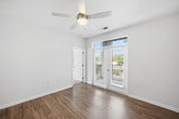 This 970-square-foot, single-floor residence at 400 Evolve Drive in Garner, NC features a thoughtfully designed open-concept layout with 2 bedrooms, 2 bathrooms, and 2 closets. The kitchen serves as the heart of the home, showcasing white shaker cabinetry, granite countertops, a center island with pendant lighting, dark subway tile backsplash, and stainless steel appliances. Light wood-look flooring flows throughout the main living areas, complementing the bright, neutral color palette. The living area features a ceiling fan and glass French doors that invite natural light and outdoor views. The primary bedroom spans 160 square feet with plush carpeting, a ceiling fan, and access to a spacious walk-in closet fitted with wire shelving. The second bedroom is similarly appointed with carpet and a ceiling fan. Both bathrooms feature granite-topped white vanities, stone-look tile flooring, and large mirrors. The primary bath includes a sleek sliding-glass walk-in shower. A second walk-in closet provides additional storage. The clean, contemporary design throughout creates a cohesive and functional living environment ideal for modern lifestyles.