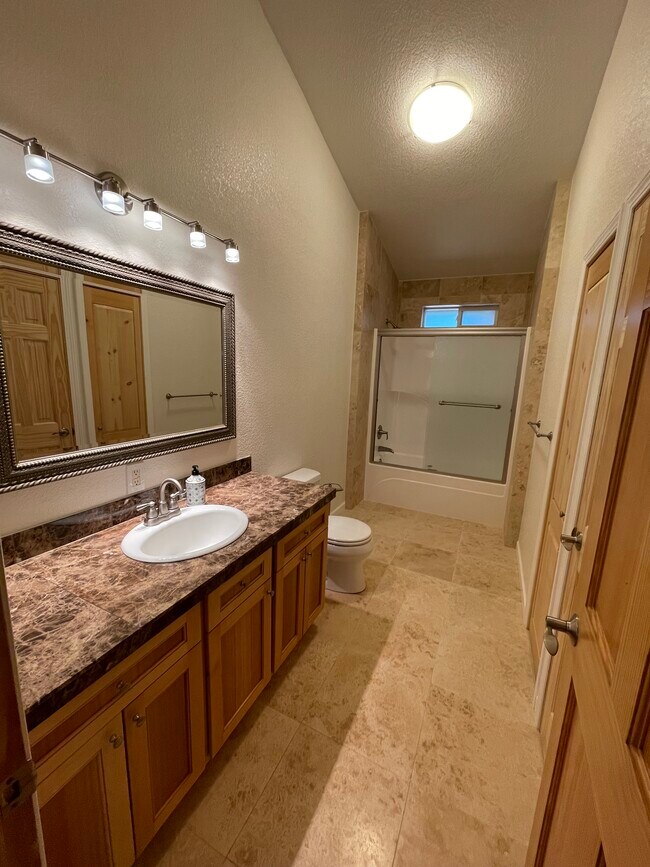 Bathroom with vaulted ceilings custom cabinetry - 160 Glenlyn Dr