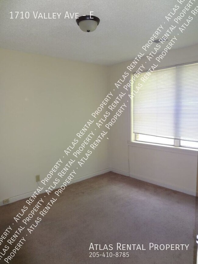 Building Photo - "Charming Homewood Townhouse: Bright, Spac...