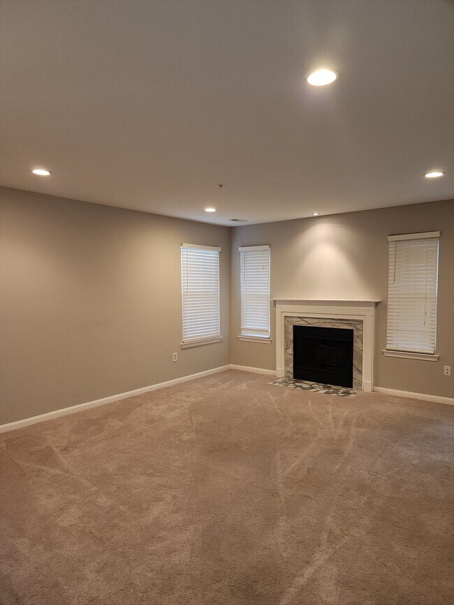 Living room with fire place. - 13900 King Gregory Way
