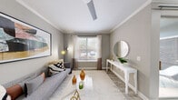 Located at 1000 Duluth Highway in Lawrenceville, GA, this thoughtfully designed one-bedroom, one-bathroom residence offers a comfortable and modern living experience across a single floor. The welcoming entrance opens into a bright living room adorned with crown molding, wood-look flooring, and a ceiling fan. A large window invites natural light and outdoor views, creating an airy atmosphere. The open-concept kitchen is a standout feature, showcasing dark espresso cabinetry, a subway tile backsplash, stainless steel appliances, and a generous white quartz island with pendant lighting — ideal for both cooking and casual dining. A sliding glass door connects the living and dining area to an outdoor space. The spacious bedroom offers plush carpeting, built-in shelving, and direct access to a walk-in closet. The bathroom features wood-look tile flooring, a dark wood vanity with a white countertop, and a shower-tub combination. A dedicated laundry area with washer and dryer hookups adds everyday convenience. Neutral gray tones throughout the residence create a cohesive, contemporary aesthetic well-suited for modern living.