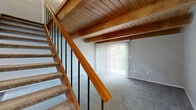 Located at 2901 County Line Rd in Kettering, Ohio, this two-story home offers 2 bedrooms and 2 bathrooms distributed across two well-balanced floors. The main level encompasses an entrance, a galley-style kitchen, and staircase access, while the upper level houses the bedrooms, bathrooms, hallway, and a closet. The kitchen is a functional highlight, featuring white shaker-style cabinetry, granite-look countertops, stainless steel appliances including a refrigerator and dishwasher, light wood-look flooring, and a window that brings in natural light and outdoor views. A warm wood-paneled ceiling accent adds character to the kitchen space. Both bedrooms are finished with soft, neutral-toned carpet and feature large windows that allow ample natural light to fill the rooms. The generously sized primary bedroom offers a comfortable retreat with good proportions. The secondary bedroom includes a double-door closet for added storage. The bathrooms are well-appointed with white cabinetry, granite-look countertops, wood-look flooring, and a tub-shower combination. Throughout, the home maintains a clean, neutral palette of warm gray and white tones, creating a bright and cohesive atmosphere suitable for a variety of interior styles.