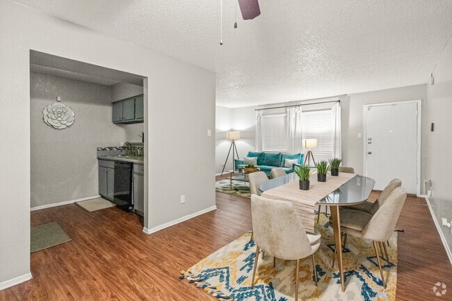 Spacious dining area with seamless flow into kitchen and living space. - Evria Terraces (NEW) Apartments