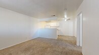 Located at 1022 E Narramore Ave in Buckeye, Arizona, this single-story, one-bedroom, one-bathroom home offers a practical and efficient layout designed to maximize every square foot. The open living and kitchen area features light wood-look flooring and a ceiling fan with light fixture, creating a bright and airy atmosphere. A peninsula counter separates the living space from the galley-style kitchen, which is equipped with white cabinetry, a double-basin stainless steel sink, a stove, and a full-size refrigerator, with ample upper and lower cabinet storage throughout.

The bedroom is a comfortable, well-proportioned space finished with plush carpeting, a ceiling fan, a closet, and a window fitted with blinds that allows for natural light. The clean, white walls throughout the home lend a neutral backdrop adaptable to a variety of furnishing styles.

The bathroom includes a single-sink vanity with a framed mirror, updated hardware, and a bathtub/shower combination, all finished with wood-look flooring that coordinates with the main living area. A dedicated laundry area adds everyday convenience. The home's straightforward, functional design makes it an efficient and easy-to-maintain residence in Buckeye, AZ.