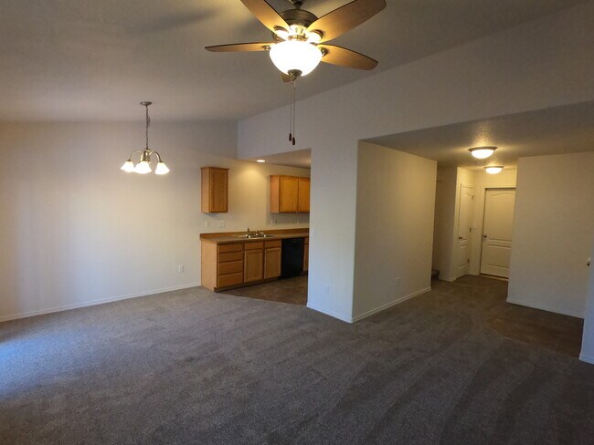 Living room, kitchen, entryway - 1653 NE Lotus Dr