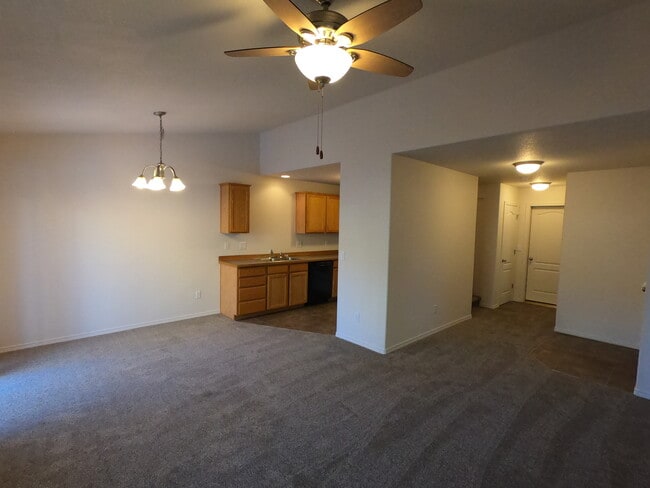 Living room, kitchen, entryway - 1653 NE Lotus Dr