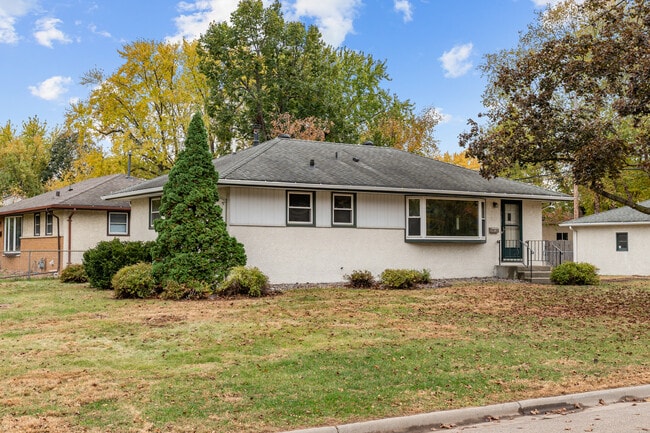 Energy efficient windows, multiple entry points, new paint, flooring and fixtures! - 7131 Ewing Ave N