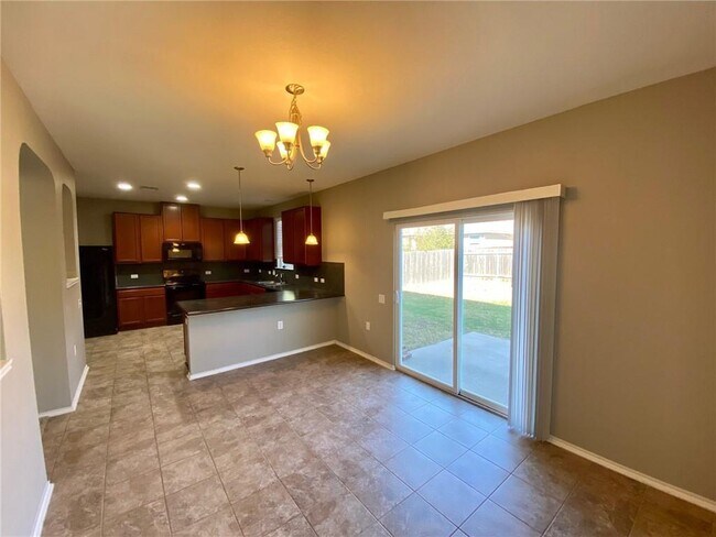 Building Photo - 6412 Garden Rose Path