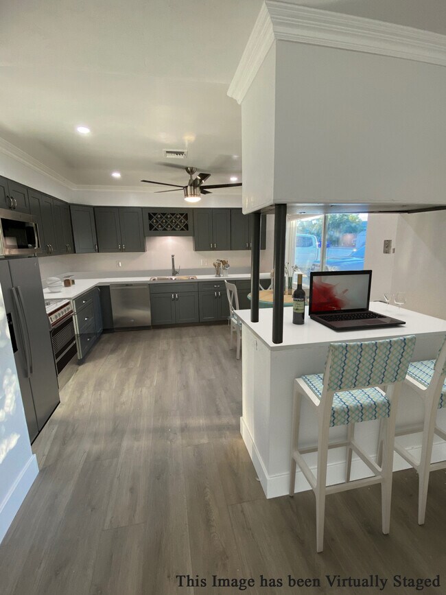 All new kitchen cabinets and island (perfect for mini office) - 4885 Normandie Pl