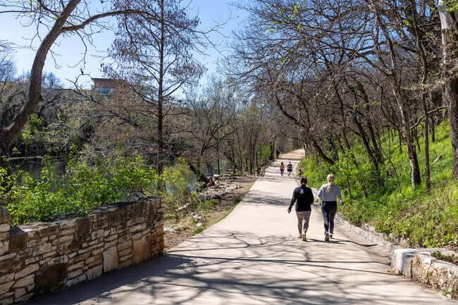 Many people enjoy walking the Ann & Roy Butler Hike and Bike in Barton Hills.