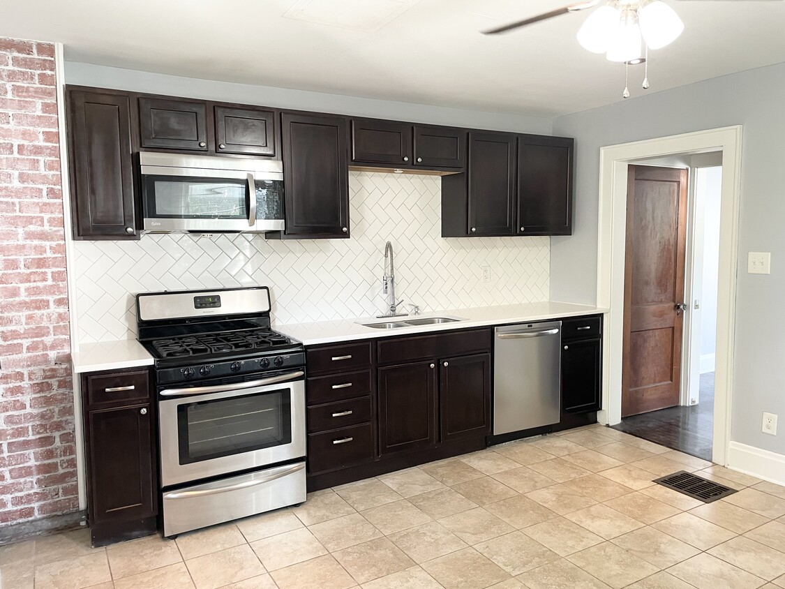 Updated Kitchen with Exposed Brick! - 249 E Jenkins Ave