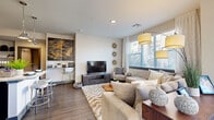 Located in Parker, Colorado, this single-floor residence offers a thoughtfully designed layout with contemporary finishes and a cohesive, modern aesthetic throughout. The open living area serves as the heart of the home, featuring durable wood-style flooring, recessed lighting, and large windows dressed with white plantation shutters that invite generous natural light. The space comfortably accommodates both a seating area and a dining nook, where a round wood table sits beneath a bright window with neighborhood views.

The kitchen is well-equipped with dark shaker-style cabinetry reaching toward the ceiling, granite countertops, stainless steel appliances including a gas range, refrigerator with ice maker, built-in microwave, and dishwasher. A peninsula provides additional prep and counter space.

Two bedrooms offer comfortable retreats, each with plush carpet, large windows, and ceiling fans or stylish lighting. The primary bedroom includes a ceiling fan and closet with sliding doors, while the secondary bedroom features a decorative window treatment and garden views.

The bathroom is finished with dark cabinetry, granite countertops, wood-style tile flooring, and a tiled soaking tub and shower combination. A well-designed hallway with art-ready walls connects all living spaces seamlessly.