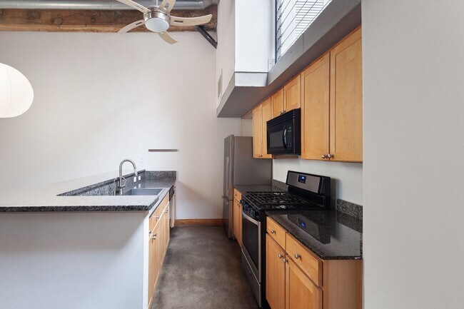 Building Photo - Industrial-Chic 2/2 Loft with Garage Near ...