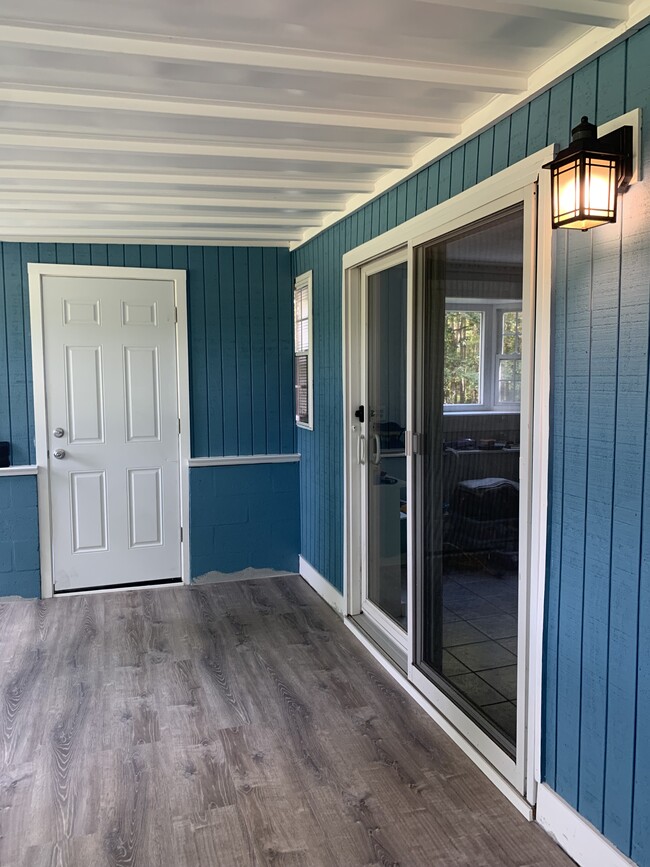 Enclosed porch entrance through sliding door - 67 E Creek Cir