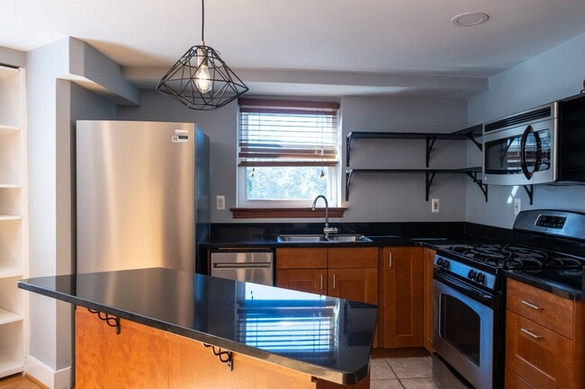 Building Photo - Bright and Peaceful One-Bedroom with Built...