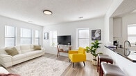 Located at 3218 Harrison St in Kansas City, MO, this single-floor, 2-bedroom, 1-bathroom home offers a clean, modern aesthetic throughout. Light wood-style flooring flows seamlessly across every room, complementing the crisp white walls and creating a cohesive, contemporary feel.

The living room serves as the heart of the home, bathed in natural light from multiple windows fitted with white blinds. A textured ceiling adds character, while the open layout provides a comfortable and versatile living space.

Both bedrooms are well-proportioned and feature the same wood-style flooring. The primary bedroom is illuminated by a sleek geometric LED ceiling fixture and includes a window for natural light. The second bedroom mirrors this bright, minimalist design with dual windows and a matching modern light fixture. Each room benefits from access to one of the three closets distributed throughout the home.

The bathroom is a standout feature, showcasing a mosaic tile floor, floor-to-ceiling stone-look tile surrounds, and a combined tub and shower — offering both style and practicality.

The layout also includes a dedicated kitchen, hallway, laundry area, and utility room, ensuring all functional needs are met. This efficient, thoughtfully designed home delivers modern comfort in a convenient Kansas City location.