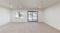 Located at 2550 Hilborn Rd in Fairfield, CA, this well-appointed 1-bedroom, 1-bathroom residence offers a thoughtfully designed single-level layout. The open-concept living room is bright and inviting, featuring plush carpet flooring, recessed lighting, and large windows alongside a sliding glass door that opens to a private balcony overlooking mature trees—bringing in generous natural light and serene outdoor views.

The galley-style kitchen is a functional highlight, showcasing dark espresso cabinetry, white quartz countertops, stainless steel appliances including a refrigerator, dishwasher, and range, as well as warm wood-look flooring. A pass-through opening connects the kitchen to the living area, enhancing the open feel of the space.

The spacious bedroom features soft carpet, ample closet space with built-in shelving, and a bright window. The unit includes an impressive six closets in total, offering exceptional storage throughout. The full bathroom is finished with dark wood cabinetry, a white vanity countertop, wood-look flooring, and a tub/shower combination. An in-unit laundry area adds everyday convenience. The clean, neutral palette throughout creates a cohesive and move-in-ready environment.