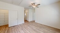 This contemporary 930 square foot residence in Port Wentworth, GA offers a thoughtful layout with 2 bedrooms and 2 bathrooms. The heart of the home is the gourmet kitchen, showcasing white cabinetry, granite countertops, and stainless steel appliances. A spacious island with a sink provides additional prep space and casual seating. The open-concept design seamlessly connects the kitchen to the living areas, creating an ideal space for entertaining.

The primary bedroom, measuring 160 square feet, features plush carpeting and a ceiling fan for comfort. Both bathrooms boast modern fixtures, including granite vanity tops and ample storage. The second bedroom mirrors the primary in style and comfort.

Throughout the home, large windows allow natural light to flood the spaces, while white walls create a bright, airy ambiance. The flooring alternates between warm wood-look planks in main living areas and soft carpeting in bedrooms. Practical features include a dedicated laundry area and multiple closets for storage.

The exterior presents a clean, low-maintenance design with siding and a covered entryway. This single-story home combines modern aesthetics with functional living spaces, perfect for those seeking a contemporary lifestyle in a compact footprint.