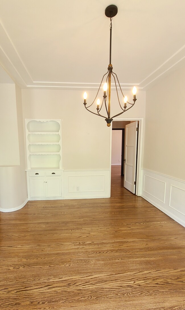 Dining room with classic built-ins and chair rails. - 1001 S Holt Ave