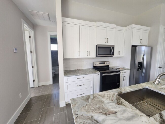 Building Photo - Beautiful New Construction 4BR/ 2BA In Cap...