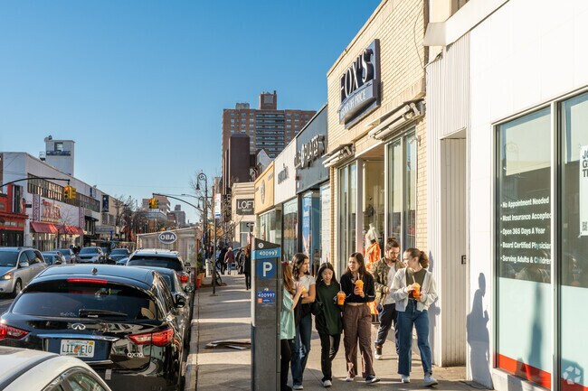 Austin St in Forest Hills is a bustling and diverse commercial and residential area.