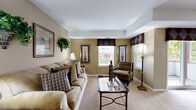 Located at 9713 Queen Anne's Lace in Laurel, MD, this thoughtfully designed one-bedroom, one-bathroom home offers a comfortable and functional single-floor layout. The welcoming entrance leads into a combined living and dining area that serves as the heart of the home. The living room features warm neutral tones, plush carpeting, and multiple windows that fill the space with natural light and views of the surrounding area. The adjacent dining area provides a dedicated space for meals and entertaining.

The kitchen is well-appointed with oak cabinetry extending to the ceiling, dark countertops, tile flooring, and a full suite of white appliances including a range, dishwasher, refrigerator, and microwave. A pantry and a utility room add practical storage and organizational convenience, while in-unit laundry enhances everyday ease.

The primary bedroom is generously proportioned, featuring soft carpeting, multiple windows with views of the outdoors, and two closets offering ample storage. The full bathroom includes a tub/shower combination, a vanity with an oak cabinet base, a large mirror, and tile flooring. Warm beige walls throughout the home create a cohesive, inviting ambiance well-suited for comfortable living.