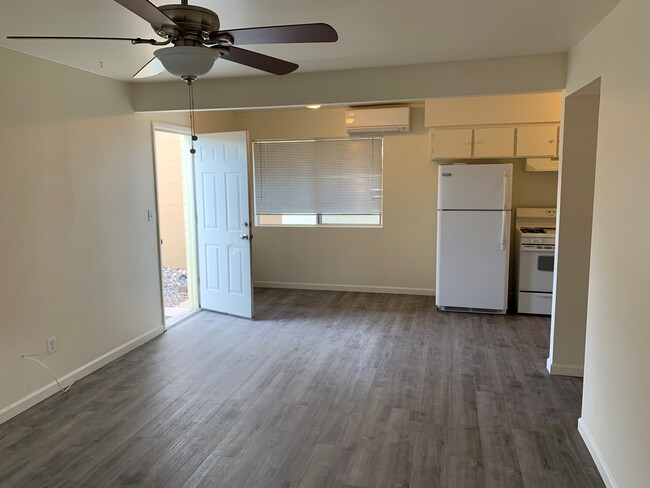 COTTAGE #1 - LIVING ROOM LOOKING TOWARDS KITCHEN AND SIDE DOOR - 549 W Wickenburg Way