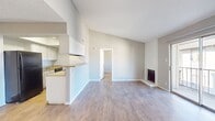 Step into a world of possibilities in this exquisite 540 square foot apartment at Addison Apartments At The Park. This thoughtfully designed one-bedroom haven is your gateway to an elevated lifestyle, where every detail has been curated for your comfort and enjoyment.

Bask in the abundance of natural light that floods through the large sliding glass doors, creating an atmosphere of warmth and spaciousness. The living area, with its sleek wood-look flooring, offers a versatile space perfect for entertaining or relaxing after a long day. Imagine cozying up by the charming fireplace on cool evenings, adding a touch of romance to your home.

The generously sized 140 square foot bedroom provides a tranquil retreat, complete with ample closet space for all your storage needs. Wake up to serene views through the well-placed window, starting each day feeling refreshed and inspired.

The modern kitchen, illuminated by stylish recessed lighting, is a culinary enthusiast's dream. Equipped with essential appliances and clean lines, it's designed for both functionality and aesthetic appeal. Whether you're preparing a gourmet meal or a quick snack, this space caters to all your needs.

Step out onto your private balcony and breathe in the fresh air as you take in the surrounding views. It's the perfect spot for your morning coffee or evening unwinding session.

The bathroom, featuring a contemporary vanity and thoughtful design, offers a spa-like experience in the comfort of your own home. With its clean lines and modern fixtures, it's a space that combines practicality with style.

At Addison Apartments At The Park, you're not just finding a place to live – you're embracing a lifestyle of comfort, convenience, and sophistication. This apartment isn't just a space; it's a canvas for your dreams, a sanctuary for your ambitions, and a testament to your success. Welcome home to the life you've always envisioned.