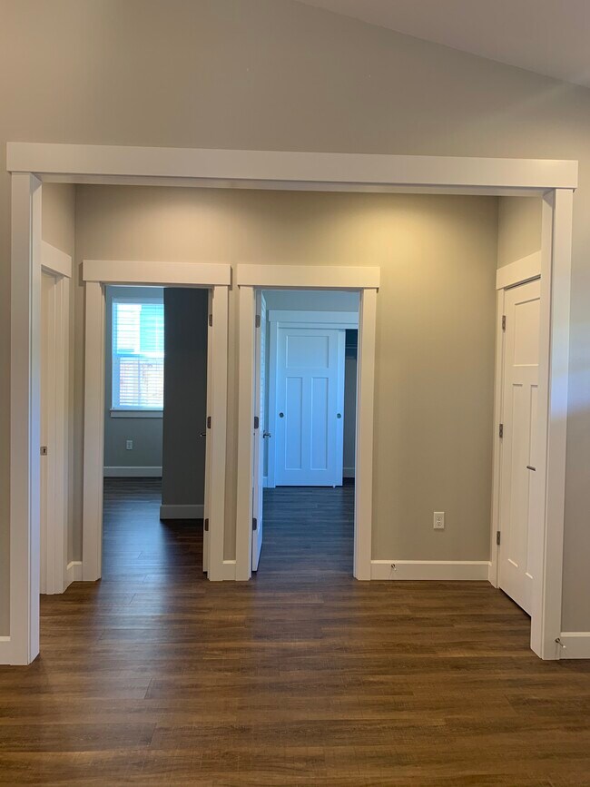 doors to bedroom 2 and 3 from the living room - 3694 NE Hembree Street