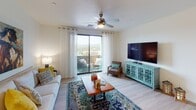 Located at 3470 Lee Cir in Prescott, Arizona, this well-appointed single-floor residence offers a thoughtfully designed open layout with contemporary finishes throughout. The living area is bright and welcoming, featuring light wood-style flooring, a ceiling fan, and large sliding glass doors that open to a private balcony showcasing sweeping views of the surrounding mountains and cityscape. The kitchen is a standout feature, boasting white shaker cabinetry, granite countertops, a center island with bar seating, pendant lighting, and a full suite of stainless steel appliances, including a refrigerator, range, and microwave. The space includes two well-sized bedrooms, each carpeted and fitted with ceiling fans, multiple windows that invite natural light, and generous closet space. One bedroom features a mirrored sliding closet, while another includes a walk-in closet. The two bathrooms are finished with wood-style flooring, granite vanity countertops, and white cabinetry. One bathroom offers a walk-in glass-enclosed shower, while the other provides a full vanity setup. Clean white walls and consistent finishes create a cohesive, modern ambiance throughout this Prescott residence.