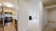 This 800 square foot apartment in Renton, Washington offers a well-designed living space with two bedrooms and two bathrooms. The single-floor layout maximizes efficiency, featuring a spacious primary bedroom of 150 square feet. The open-concept living area combines the kitchen and living room, creating a sense of spaciousness and flow.

The apartment boasts modern finishes throughout, including carpeted bedrooms for comfort and wood-look flooring in the bathrooms and kitchen for durability and easy maintenance. The kitchen is equipped with light wood cabinetry, providing ample storage, and features black appliances for a sleek look.

Large windows in the bedrooms and living area allow for plenty of natural light, enhancing the overall ambiance. The bathrooms are well-appointed with white fixtures and vanities with ample counter space. Each bedroom includes a closet for storage, and the unit has a total of two closets.

The apartment's neutral color palette and clean lines create a contemporary feel, suitable for various decorating styles. The layout is designed for comfortable living, with clear separation between private and communal spaces. Located at 500 Monroe Ave NE in Renton, this apartment offers a balanced combination of functionality and modern comfort.