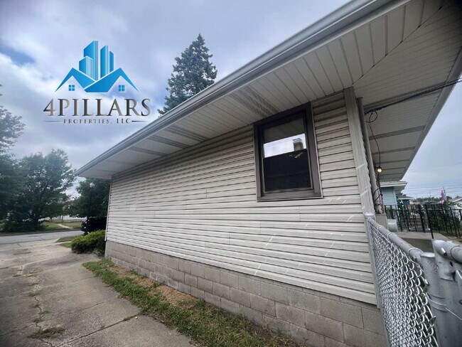 Foto del edificio - "Charming 3-Bedroom Haven with Finished Basement & Gleaming Hardwood Floors in Hammond!"