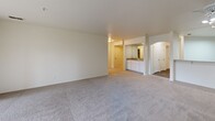 Located at 1175 Lake Blvd in Davis, California, this single-story, 3-bedroom, 3-bathroom home offers a well-organized and functional floor plan. The combined kitchen and living area forms the heart of the home, featuring wood-style plank flooring, white cabinetry, light countertops, a double-basin sink, a dishwasher, and a ceiling fan. An arched passageway connects the kitchen to additional living spaces, adding a subtle architectural detail to the open layout.

The bedrooms are carpeted for comfort, with the generously sized primary suite offering a dual-sink vanity with a large mirror, a walk-in closet with built-in shelving and hanging rods, and its own private bathroom. The secondary bedrooms are also well-proportioned, each with access to closet space. One bedroom features a window with an outdoor view, bringing in natural light.

The bathrooms are clean and functional, with at least one featuring a combination tub and shower with a curtain rod, set against wood-style flooring. Six-panel doors and flush-mount ceiling lighting are consistent throughout, contributing to a cohesive, neutral aesthetic. The overall design is practical and move-in ready, suited for comfortable everyday living.