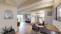 Located at 8680 E Alameda Ave in Denver, Colorado, this single-floor residence offers a thoughtfully designed open-concept layout that seamlessly connects the living, dining, and kitchen areas. The living room features light wood-style flooring, exposed beam detailing on a textured ceiling, and a wall-mounted air conditioning unit. A sliding glass door opens directly onto a private balcony, filling the space with natural light and providing outdoor access. The kitchen is outfitted with white cabinetry, stainless steel appliances including a full-size refrigerator, and clean countertops, complemented by an adjacent dining area with ample room for a full dining set. The bedroom is carpeted for comfort and includes a spacious sliding-door closet with shelving, a bright window with blinds, and direct access to the hallway. The bathroom features a tub-shower combination, wood-style flooring, and functional fixtures. Throughout the residence, neutral tones and consistent flooring create a cohesive, modern aesthetic. The open sightlines between the living and dining areas enhance the sense of space, making this a comfortable and functional Denver home.
