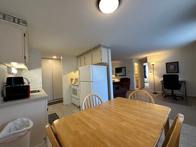 Dining Table and All Dishes and Cookware Provided to Feel at Home. - Avalon Suites Apartments