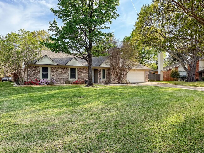 Front yard and full home view from the street with established trees - 2006 Candle Ct