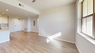 Located at 3145 Market St in Riverside, CA, this well-appointed single-floor residence offers 2 bedrooms and 2 bathrooms within a thoughtfully designed open-concept layout. Light wood-look flooring runs throughout, complementing a bright, neutral color palette that creates a clean and modern aesthetic.

The kitchen is a standout feature, showcasing crisp white shaker cabinetry, light quartz countertops, a stainless steel appliance suite including a gas range, microwave, and refrigerator, and a central island with a double-basin sink that flows seamlessly into the dining and living areas. A pantry provides additional storage, while a dedicated laundry area and utility room add everyday convenience.

The living room is filled with natural light through large windows and a glass door leading to a private balcony, with a ceiling fan overhead enhancing comfort. Both bedrooms are generously sized, featuring natural light from windows with blinds and access to closets. The primary bedroom connects to a well-appointed bathroom with a backlit vanity mirror, quartz countertop, white cabinetry, and an adjacent walk-in closet. The second bathroom mirrors the same refined finishes. With five closets distributed throughout, storage is abundant in this polished Riverside residence.